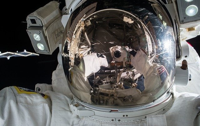 Astronaut influencer thinking about new SAG-AFTRA influencer agreement for branded content