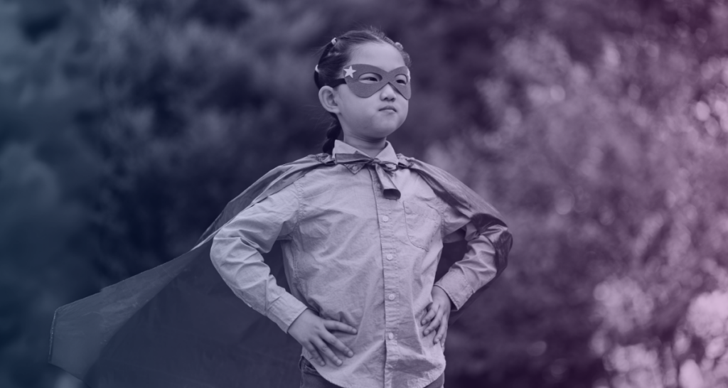 Coogan accounts protect the future finances of child actors. A child actor is depicted here, wearing a super hero cape and mask. 