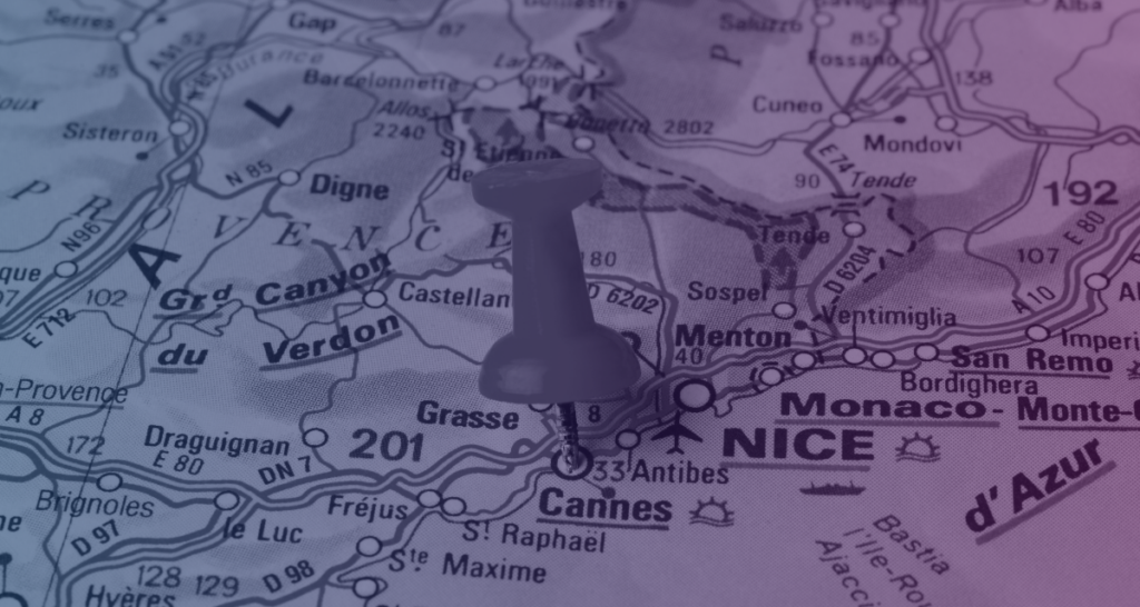 A map of the south of France with a push pin in the city Cannes, where a major pre-sales market gathers every year.